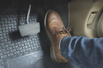 Close up Leather Shoe ob pedal in car