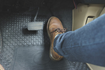 Close up Leather Shoe ob pedal in car