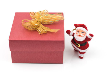 Santa claus doll and gift box  isolated on white background .