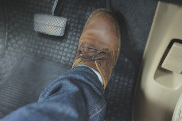 Close up Leather Shoe ob pedal in car