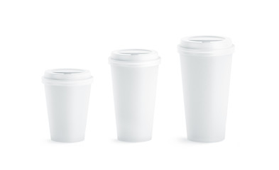 Blank white disposable paper cup mock ups with closed lids isolated, 3d rendering. Empty coffee drinking mug mockup front view. Clear tea take away plastic package, cofe shop branding template.