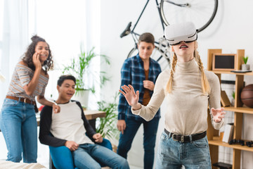 excited teen girl watching something with virtual reality headset