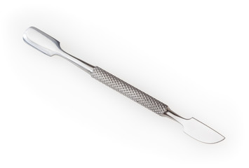 Steel manicure cuticle pusher isolated on white background with clipping path