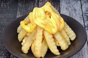 Volcano French fries as French fries topped with cheese arranged is like the volcano .