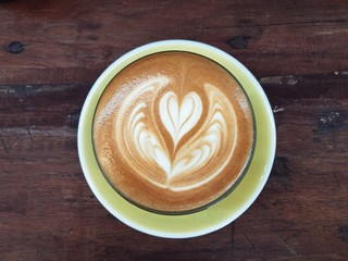 top view latte Art mini heart shape on the wooden table, vintage style 