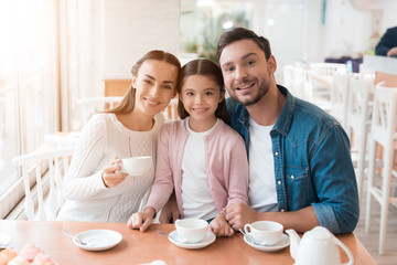 A young family came together in a cafe.