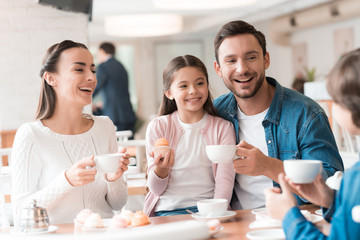 A young family came together in a cafe.