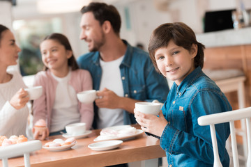 A young family came together in a cafe.