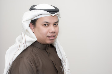 Portrait of Asian man wear the Arab traditional uniform