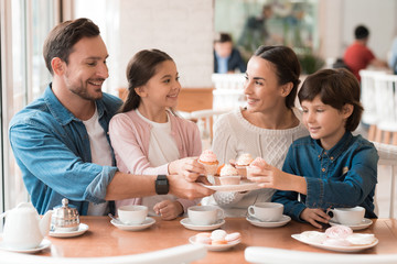 A young family came together in a cafe.