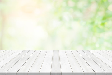 White table top on green blurred background,space for montage product