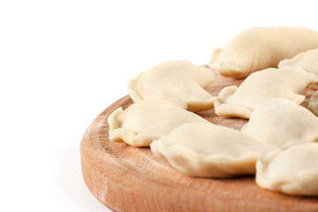 Raw ravioli on wood desk