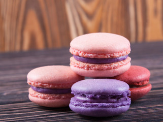 Color macaroons on wood desk