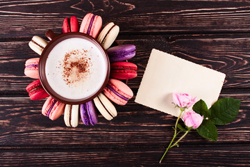 Color macaroons on wood desk