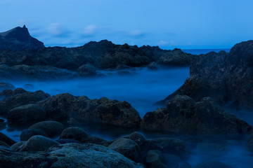 Fototapeta na wymiar Powerful ocean waves offshore stone beach