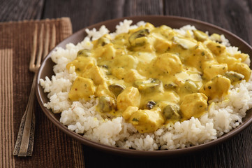 Chicken with mushroom in curry cream sauce.