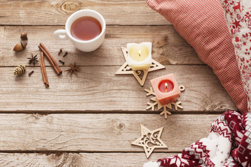 candles and Christmas decoration on wooden background