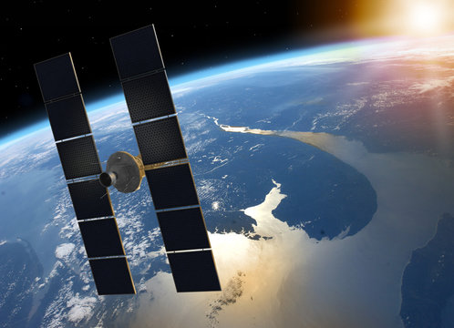 Fototapeta Space Satellite Orbiting Planet Earth