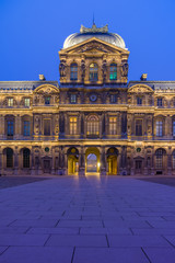 Fototapeta na wymiar iew of famous Louvre Museum with Louvre Pyramid at evening