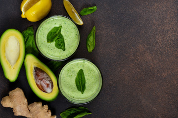 Green smoothies made from yogurt with avocado and spinach. Detox food. Top view.