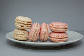 homemade macarons on grey background