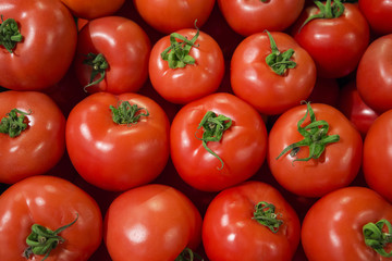 texture of the red juicy tomatoes on the counter in the store of organic farmers products