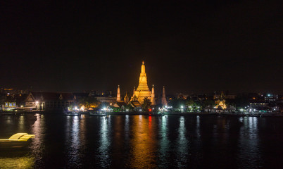 Night View of WAT ARUN (TEMPLE OF DAWN) and Chao Phraya River, Bangkok, Thailand.