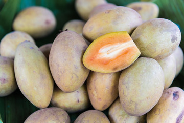 Sapodilla fruits on banana leaf