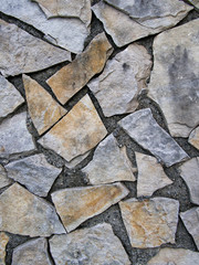 Stone wall cladding in the style of crazy paving.