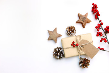 Christmas festive styled stock image. Floral frame composition with gift box, craft paper tag, pine...