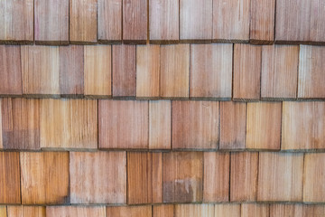 Wooden larch shingles on roof background, Traditional wooden roof, Roof made of wood background, Traditional wood roof technology, Background frosted pine wood, Natural background board