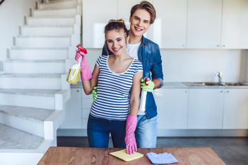 Couple is doing cleaning at home