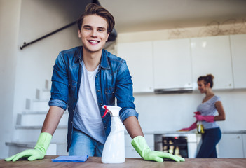 Couple is doing cleaning at home