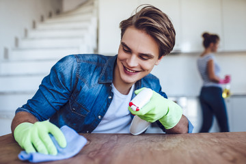 Couple is doing cleaning at home