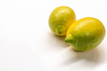 Group of ripe whole yellow lemon citrus fruit isolated on white background with clipping path