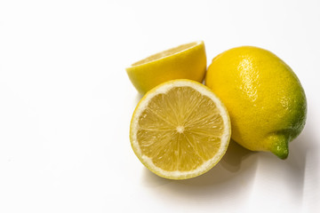 Textured ripe slice of lemon citrus fruit isolated on white background.