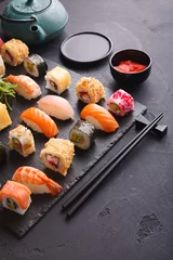 Gordijnen Sushi and rolls background, japanese cuisine © Prostock-studio