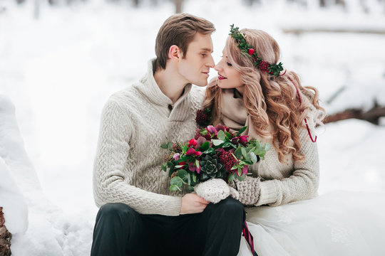 Bride and groom in winter forest. Moment before a kiss. Artwork