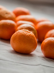 mandarin close up on white wooden background