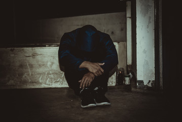 Portrait of asian man sad,drug addict man sitting on the floor,flakka drug,zombie drug