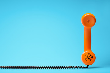 Telephone in retro style on blue background.