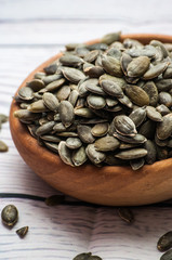 Raw pumpkin seeds, food background, 