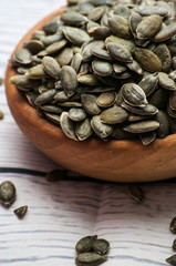 Raw pumpkin seeds, food background, 