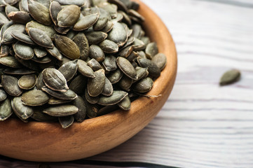 Raw pumpkin seeds, food background, 