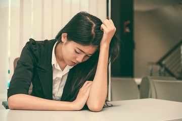 Close up sad woman in the office,stress girl from hard work,Heartbreak from boyfriend,Thailand people