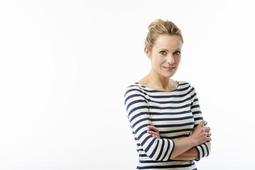 Confident mature woman standing against white isolated background