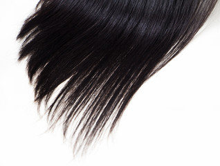 Closeup black shiny hair on white background.
