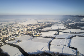 Aerial winterwonderland view with drone of snowy forest in Lower Austria