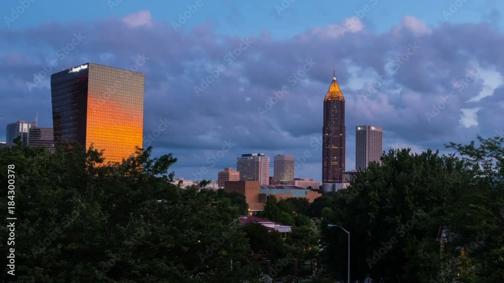 Wall mural atlanta, usa. time-lapse of midtown in atlanta, usa night to day. fast pacing clouds over the bank o