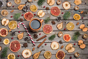 New Year composition of dried fruits on a wooden table. Christmas background. Flat lay.Top view